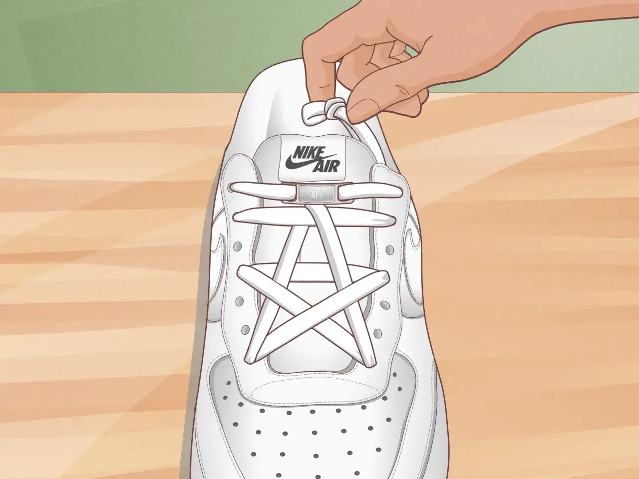 Eine Hand bindet die Schnürsenkel eines weißen Air Force 1 Sneakers.