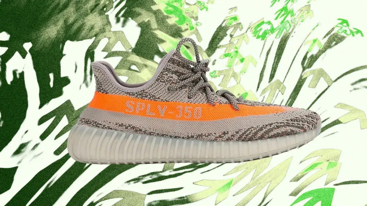 Grauer Yeezy Boost 350 V2 mit orangefarbenem Streifen und
